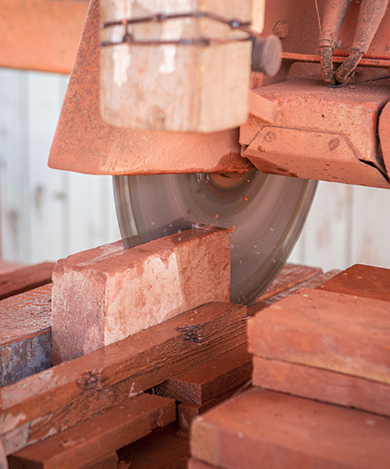 We cut Belgian/Dutch, aged clay bricks into corners and tiles.